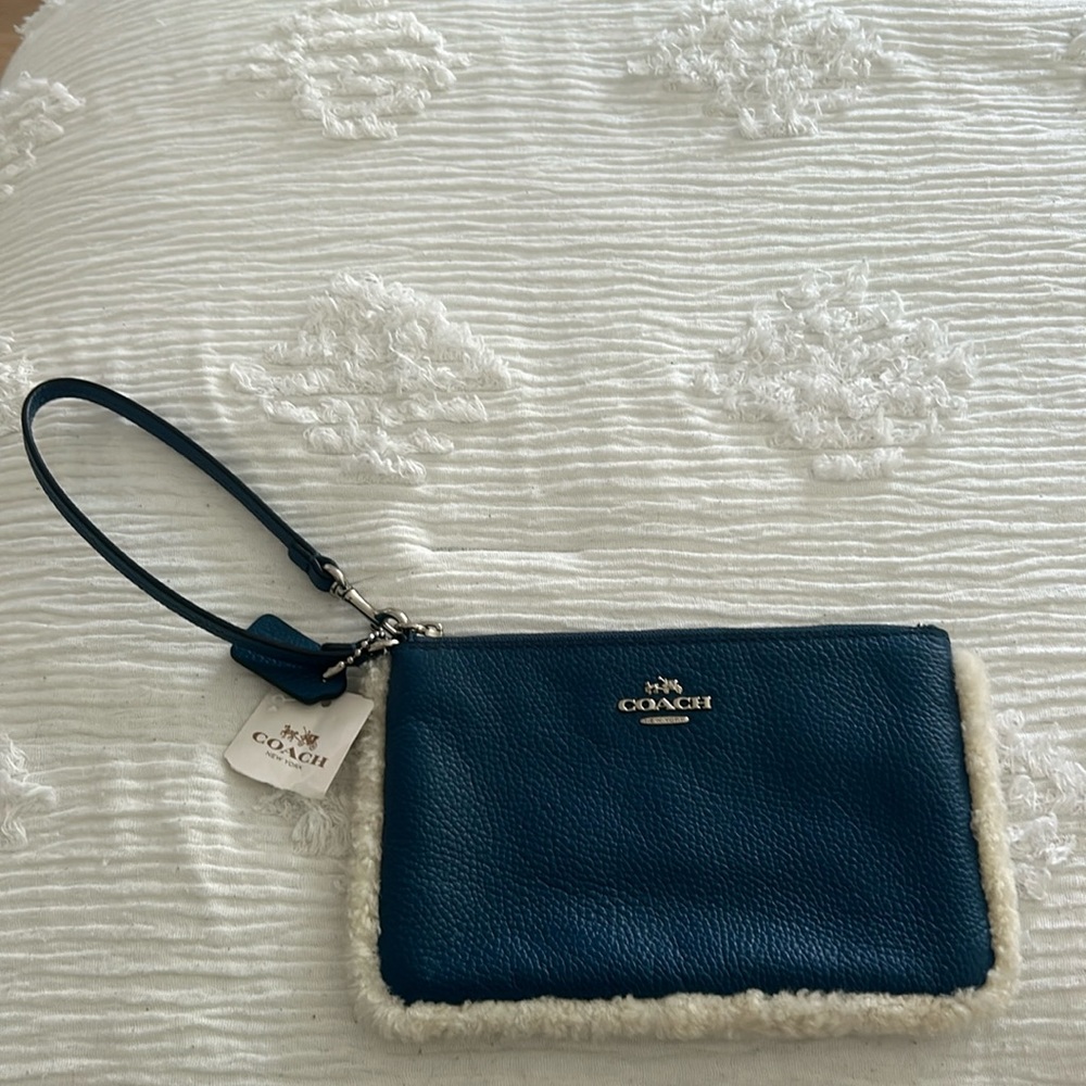 Navy blue Coach wristlet (with fur)
